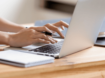 women typing on lapytop keyboard